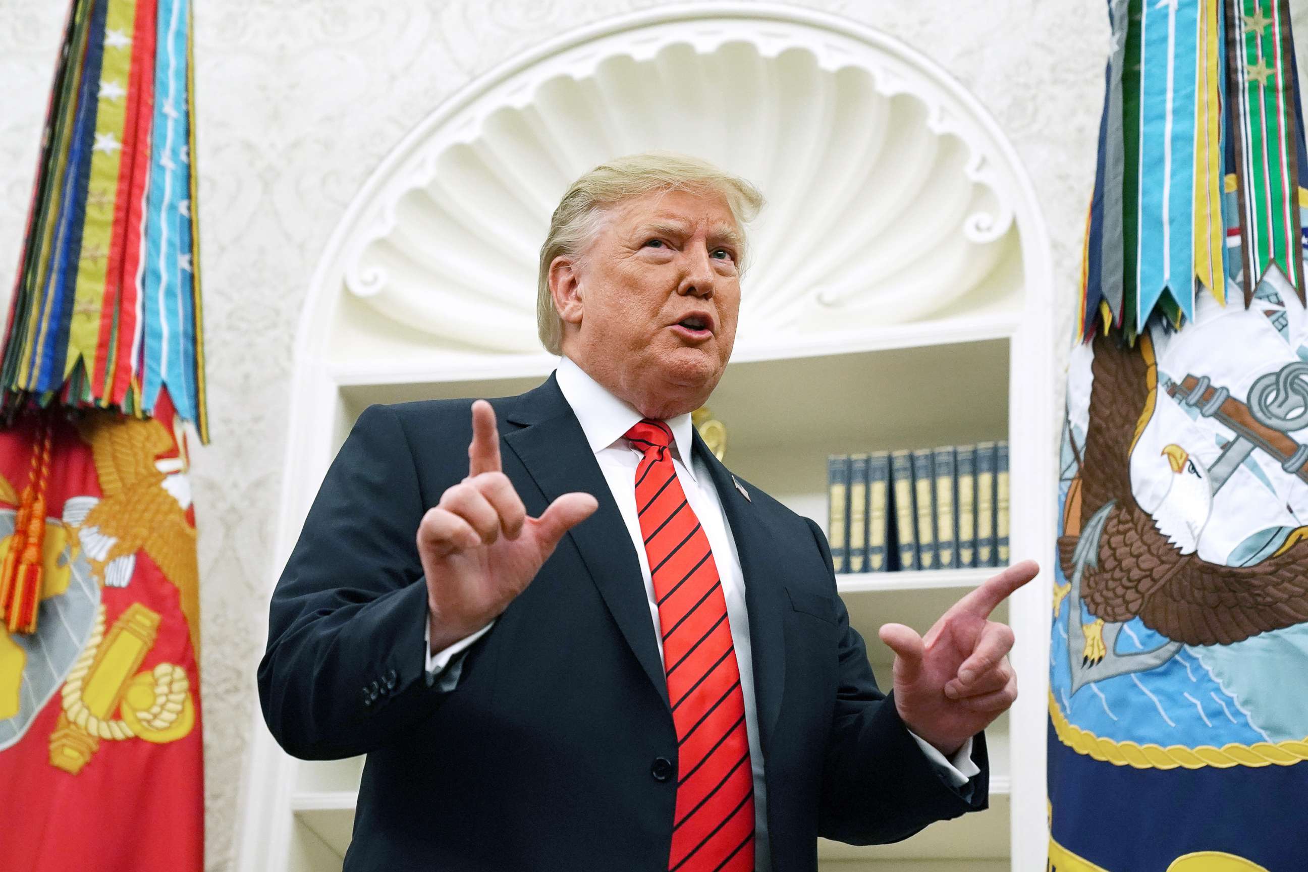 PHOTO: President Donald Trump gives pauses to answer a reporters' question about a whistleblower as he leaves the Oval Office after hosting the ceremonial swearing in of Labor Secretary Eugene Scalia at the White House, Sept. 30, 2019.