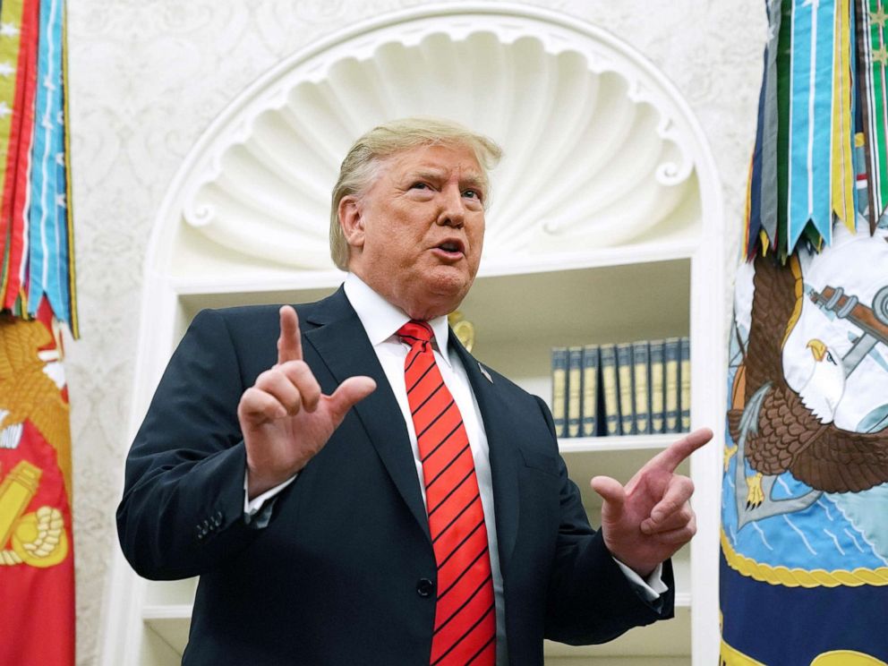 PHOTO: President Donald Trump gives pauses to answer a reporters question about a whistleblower as he leaves the Oval Office after hosting the ceremonial swearing in of Labor Secretary Eugene Scalia at the White House, Sept. 30, 2019.