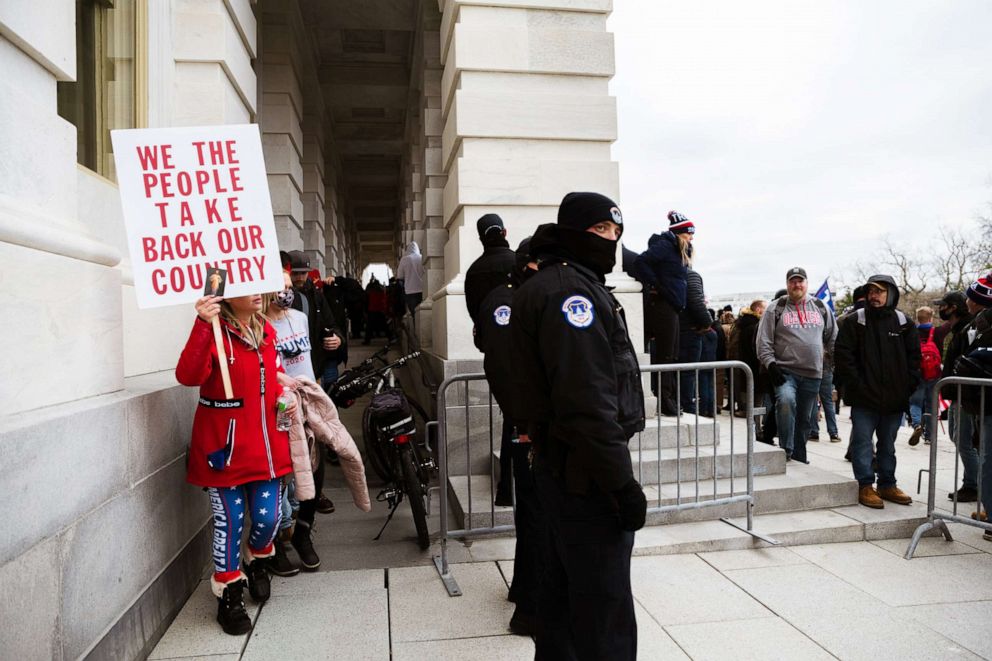 PHOTO: Member of a pro-Trump mob exit the Capitol Building after teargas is dispersed inside, Jan. 6, 2021, in Washington, D.C.