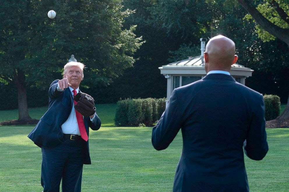 PHOTO:President Donald Trump plays ball with Mariano Rivera, the MLB Hall of Fame closer from the Yankees, during a Major League Baseball Opening Day event at the White House, July 23, 2020.