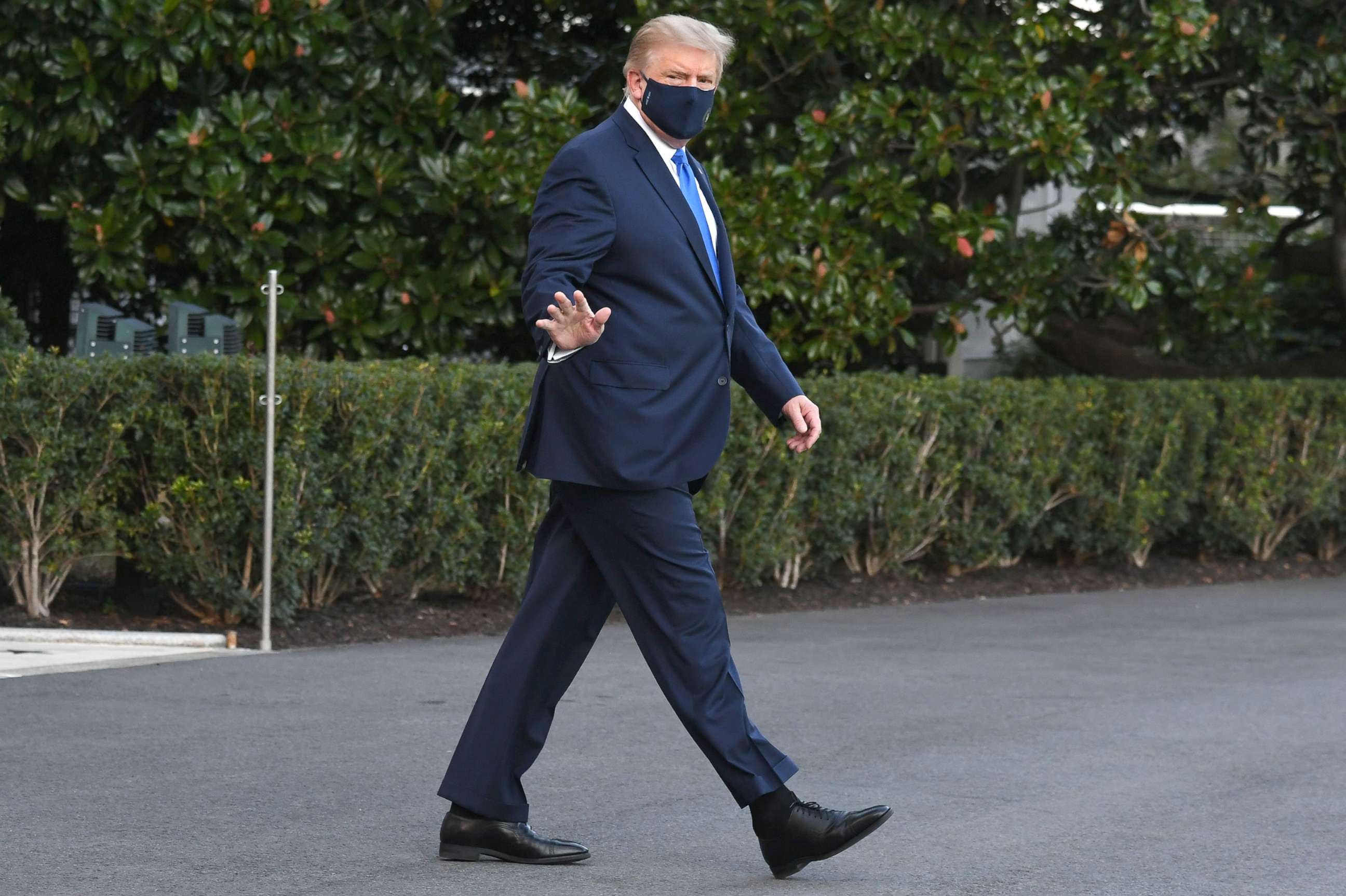 PHOTO: President Donald Trump walks to Marine One prior to departure from the South Lawn of the White House, Oct. 2, 2020, as he heads to Walter Reed Military Medical Center, after testing positive for Covid-19. 