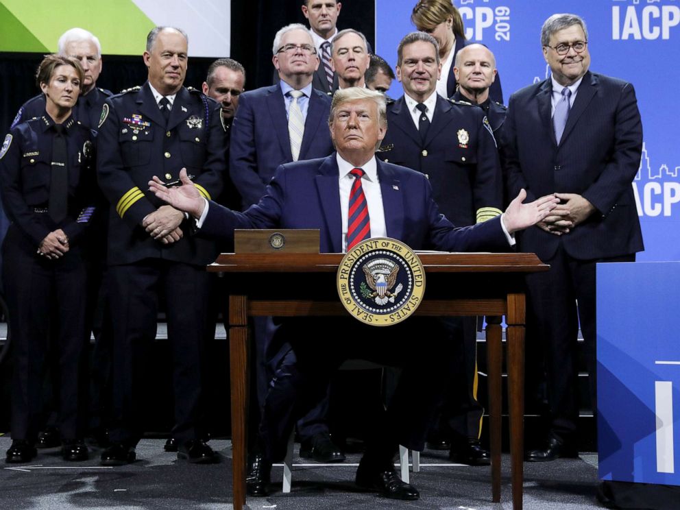 PHOTO: President Donald Trump reacts after signing an executive order during an appearance at the International Association of Chiefs of Police annual conference and expo in Chicago, Oct. 28, 2019.