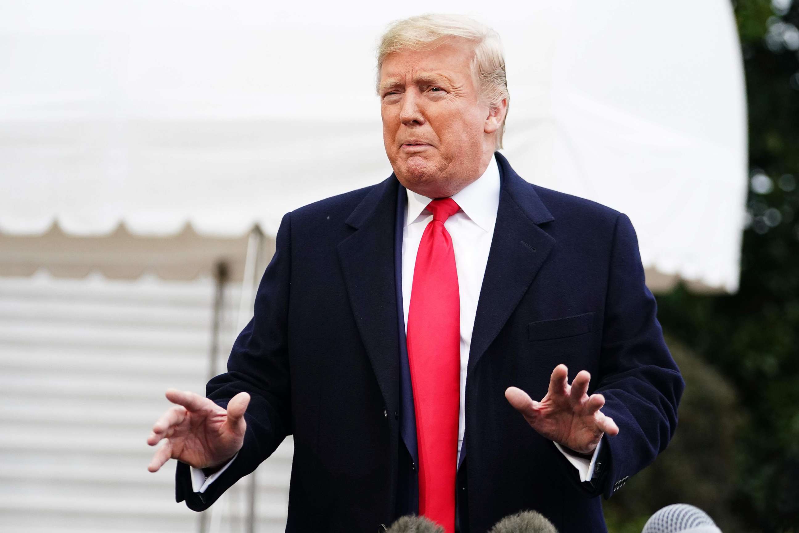 PHOTO: President Donald Trump talks to reporters before departing from the South Lawn of the White House, Jan. 13, 2020. 