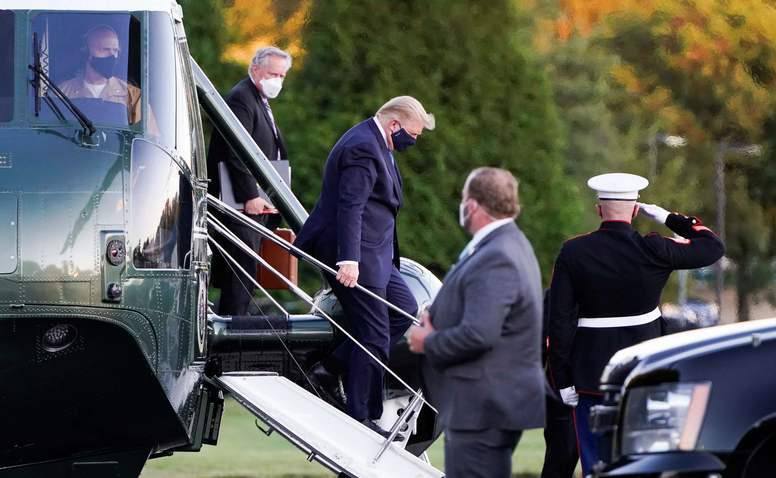 PHOTO: President Donald Trump disembarks from the Marine One helicopter followed by White House Chief of Staff Mark Meadows as he arrives at Walter Reed after testing positive for COVID-19, in Bethesda, Md., Oct. 2, 2020.  