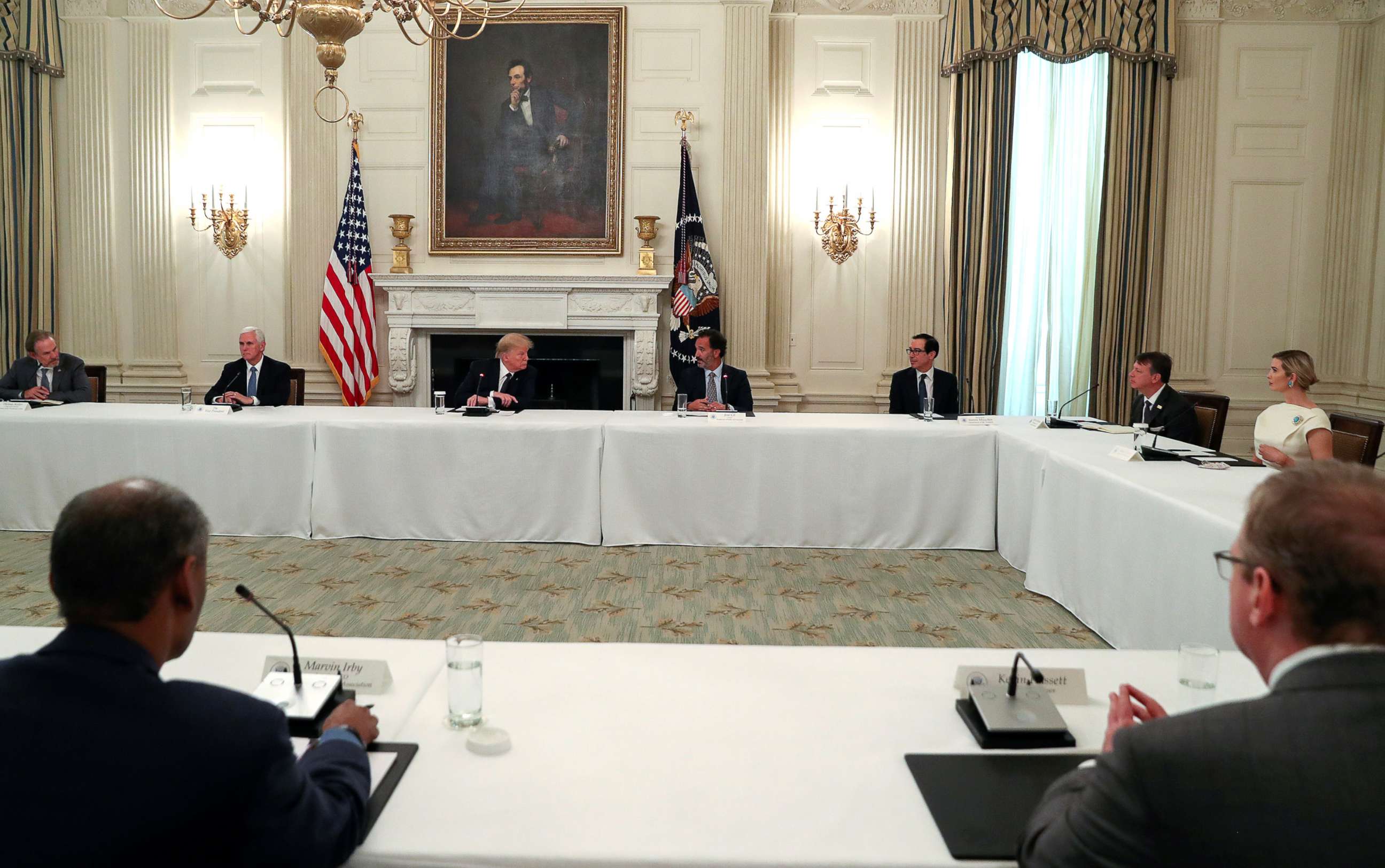 PHOTO: President Donald Trump speaks with restaurant executives and industry leaders during a coronavirus disease (COVID-19) pandemic meeting in the State Dining Room at the White House, May 18, 2020. 