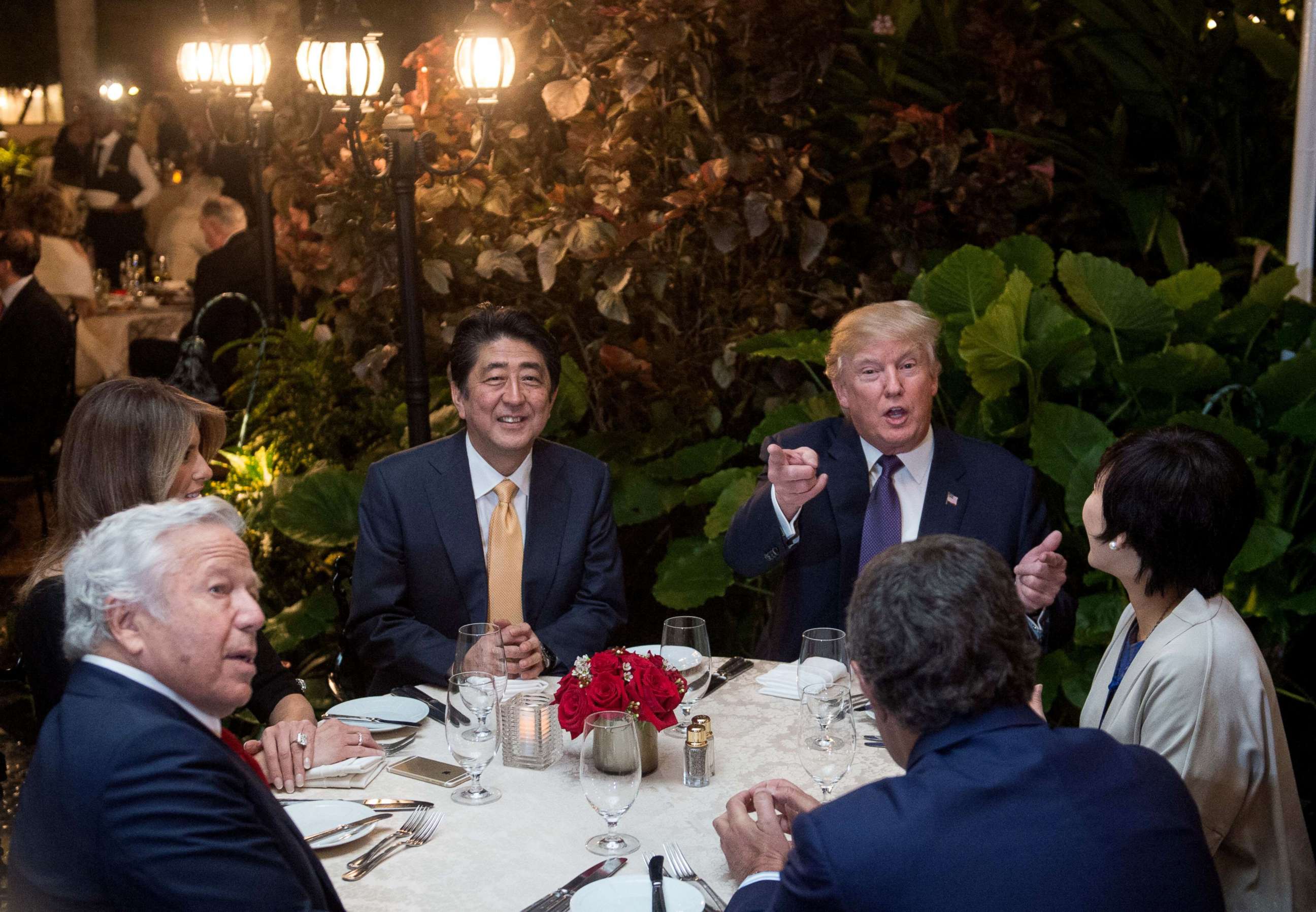 PHOTO: President Donald Trump, Japanese Prime Minister Shinzo Abe, and his wife Akie Abe, first lady Melania Trump and Robert Kraft sit down for dinner at Trump's Mar-a-Lago resort, Feb. 10, 2017.