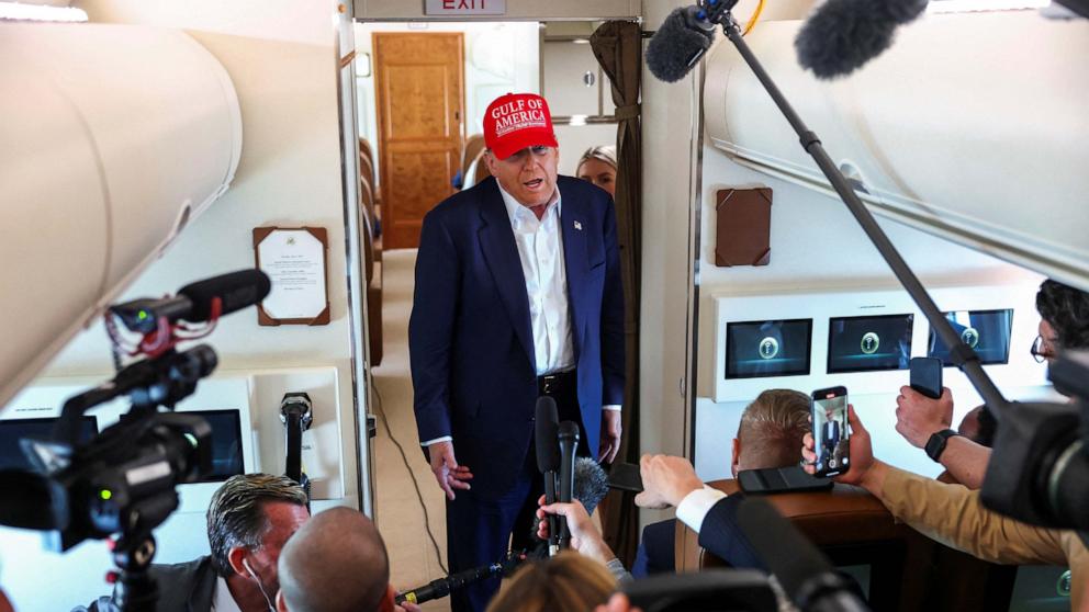PHOTO: President Donald Trump speaks to reporters aboard Air Force One en route to Joint Base Andrews, Maryland, after touring a temporary migrant detention center informally known as "Alligator Alcatraz" in Ochopee, Fla., July 1, 2025. 