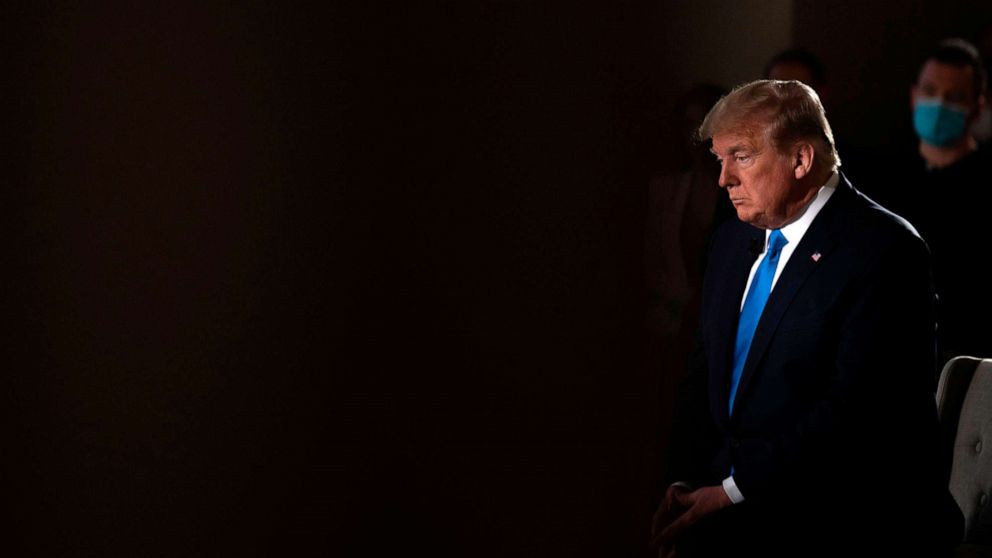 PHOTO: President Donald Trump sits during a commercial break of a Fox News virtual town hall "America Together: Returning to Work," event from the Lincoln Memorial in Washington, DC., on May 3, 2020.