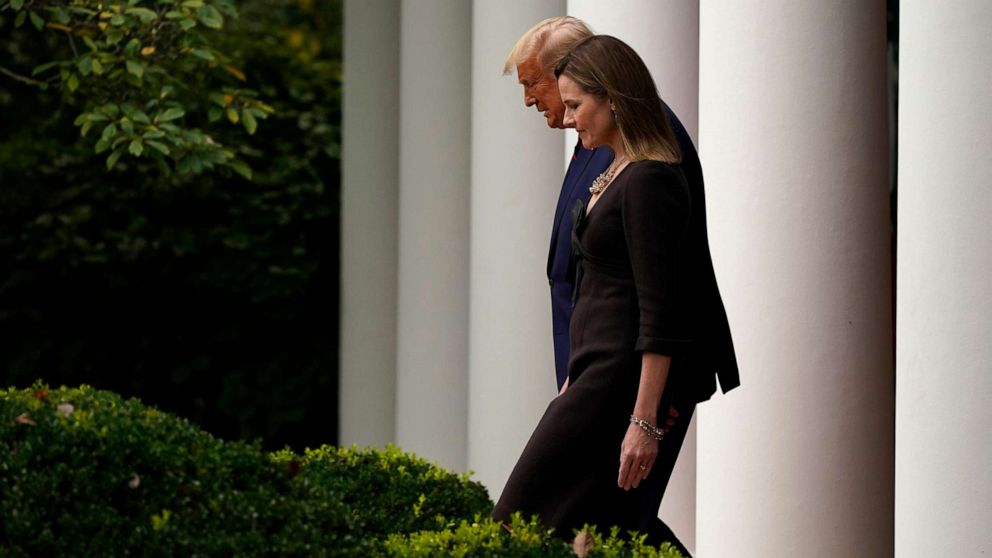 PHOTO: President Donald Trump walks with Judge Amy Coney Barrett to a news conference to announce Barrett as his nominee to the Supreme Court, in the Rose Garden at the White House, Sept. 26, 2020, in Washington.