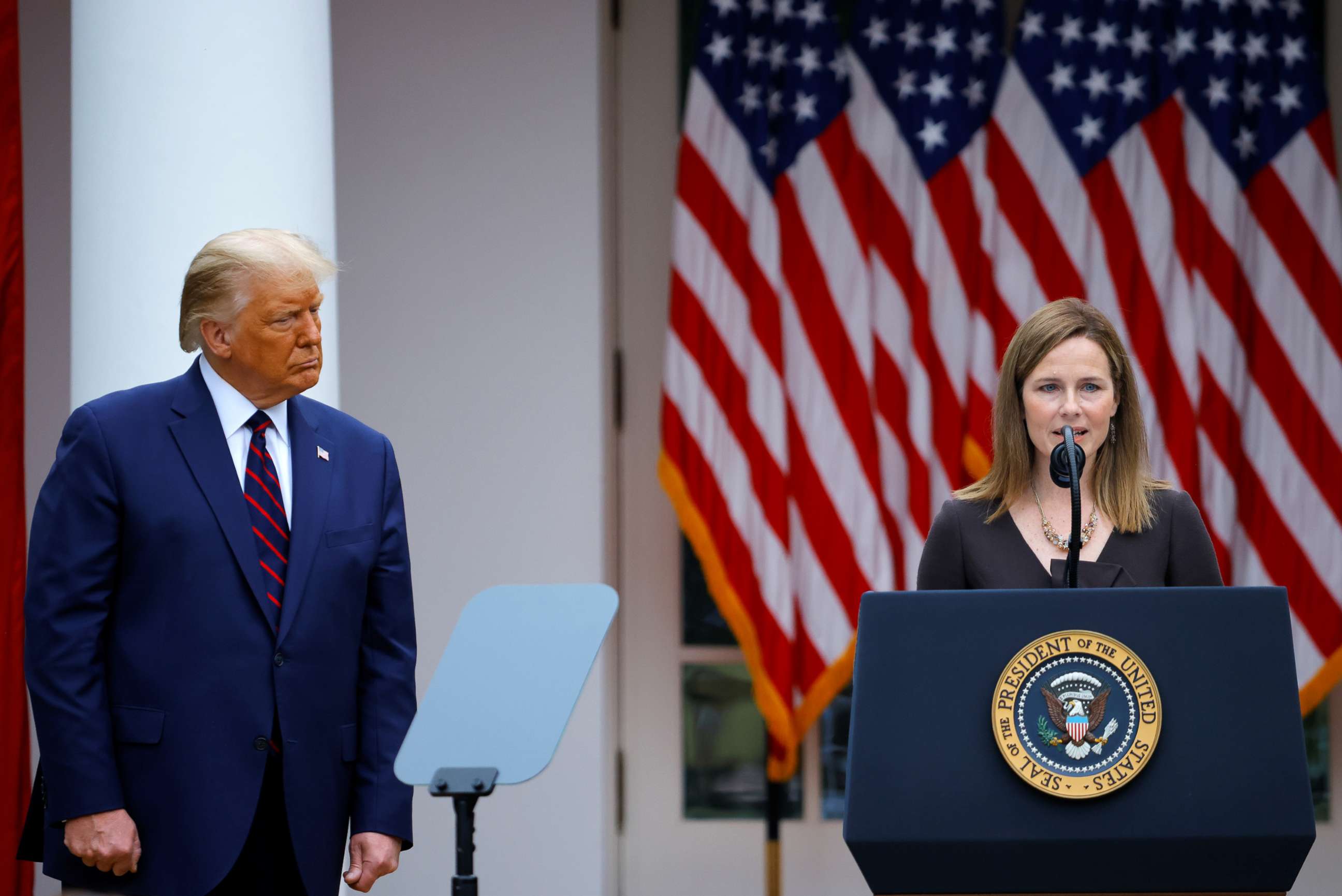 PHOTO: President Donald Trump watches Judge Amy Coney Barrett deliver remarks as he holds an event to announce her as his nominee to fill a Supreme Court seat at the White House in Washington, Sept. 26, 2020.
