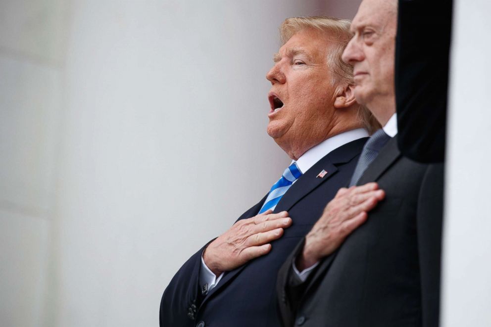 PHOTO: President Donald Trump sings the national anthem during a Memorial Day ceremony at Arlington National Cemetery, May 28, 2018, in Arlington, Va., with Defense Secretary Jim Mattis.