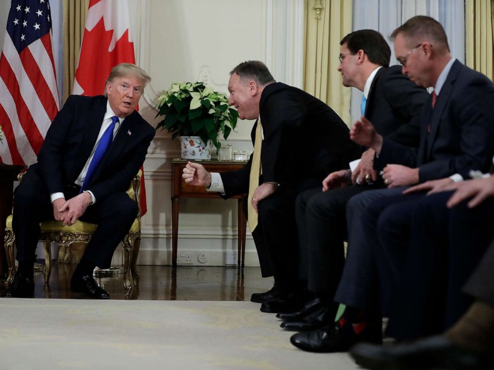 PHOTO: President Donald Trump talks with Secretary of State Mike Pompeo during a meeting with Canadian Prime Minister Justin Trudeau at Winfield House, Dec. 3, 2019, in London. 