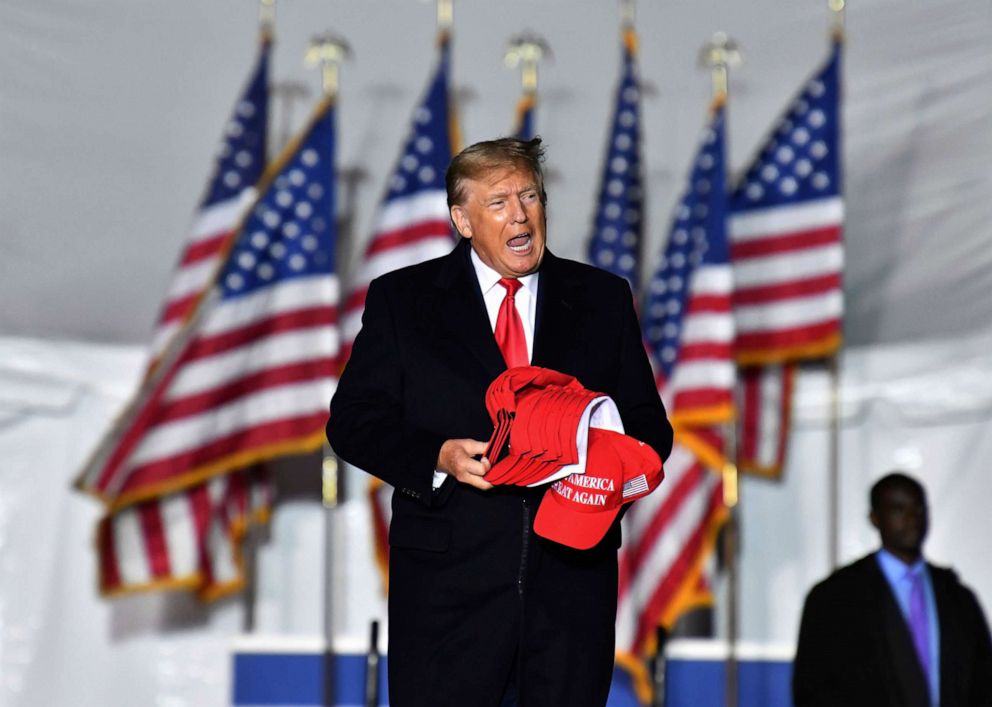PHOTO: Former President Donald Trump enters the stage during a rally for Georgia GOP candidates at Banks County Dragway in Commerce, Ga., March 26, 2022.