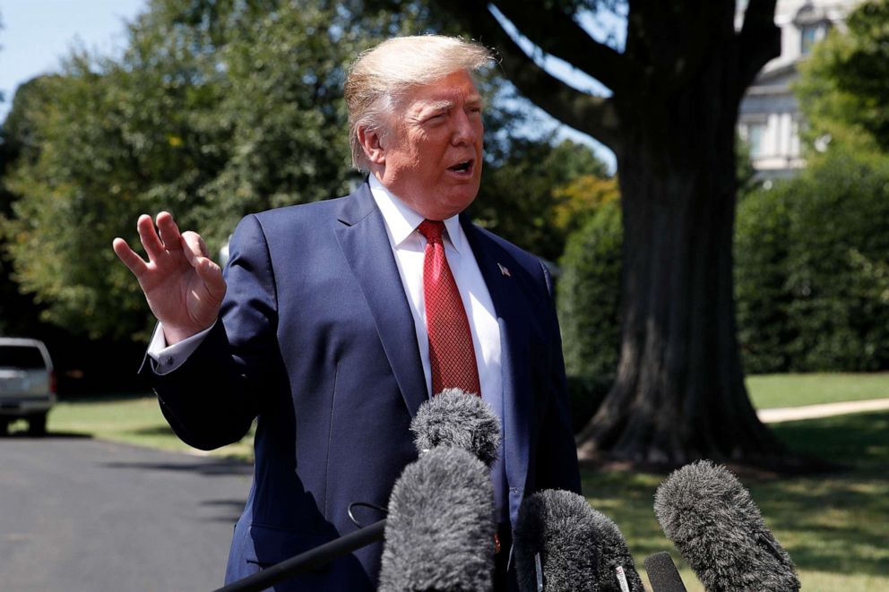 PHOTO: President Donald Trump speaks with reporters before departing on Marine One on the South Lawn of the White House, Wednesday, Aug. 21, 2019, in Washington.