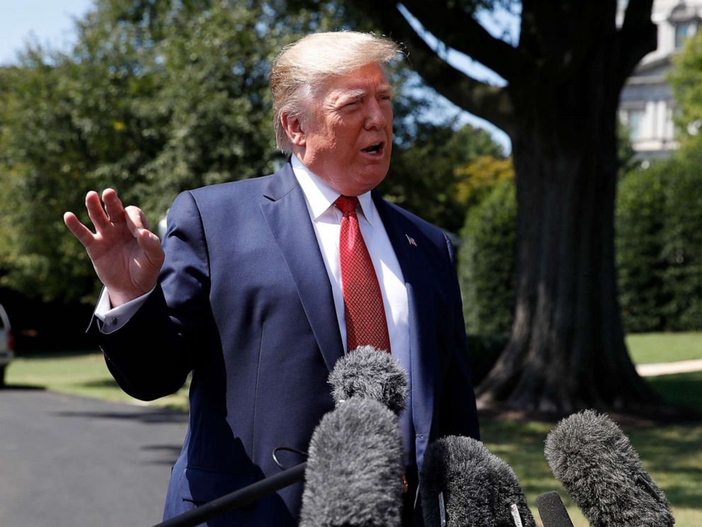 PHOTO: President Donald Trump speaks with reporters before departing on Marine One on the South Lawn of the White House, Wednesday, Aug. 21, 2019, in Washington.