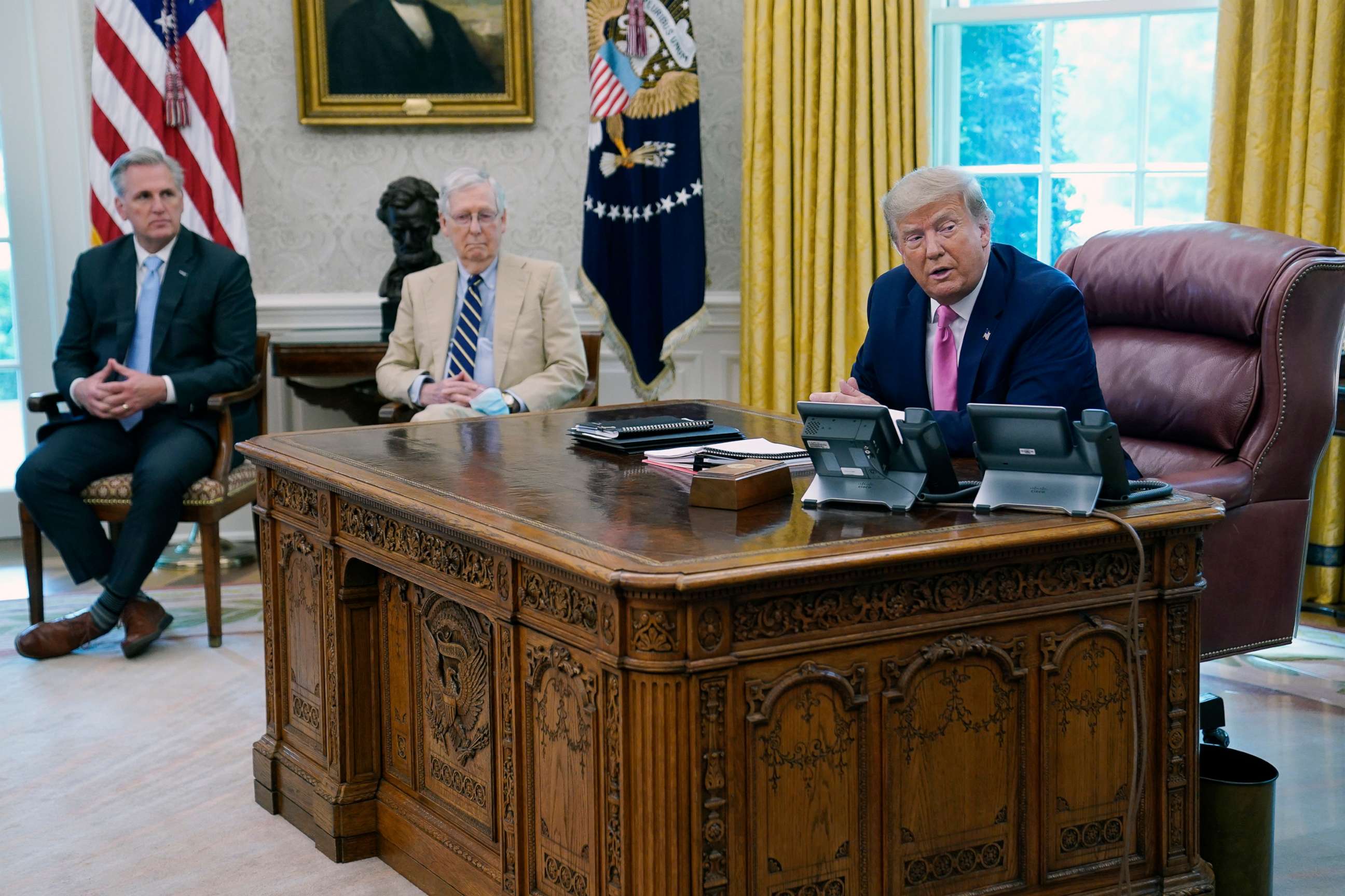 PHOTO: President Donald Trump meets with Senate Majority Leader Mitch McConnell, center, and House Minority Leader Kevin McCarthy in the Oval Office at the White House, July 20, 2020, in Washington.