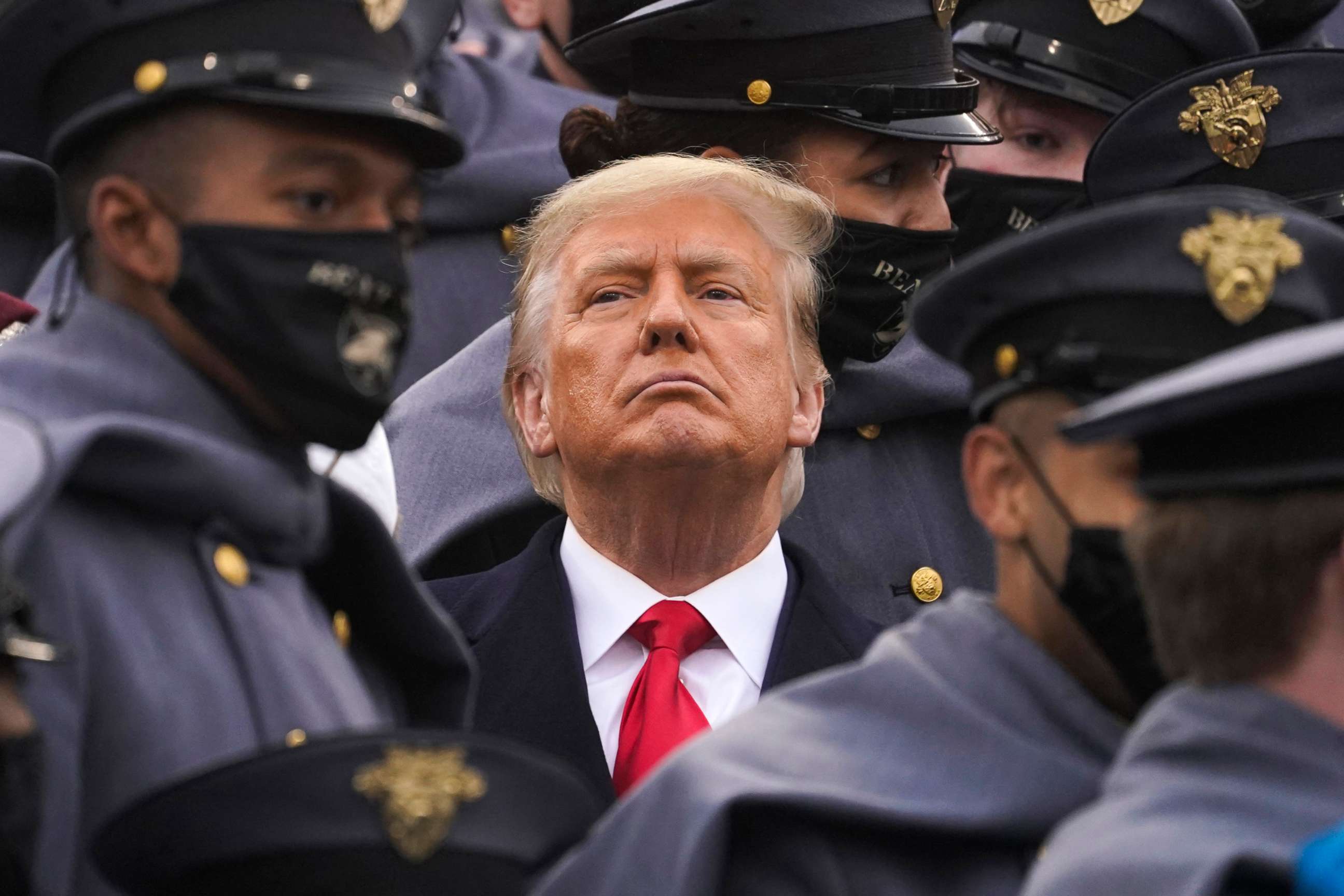PHOTO: Surrounded by Army cadets, President Donald Trump watches the first half of the 121st Army-Navy Football Game in Michie Stadium at the United States Military Academy, Saturday, Dec. 12, 2020, in West Point, N.Y.
