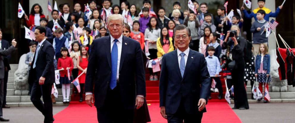 PHOTO: President Donald Trump and South Korean President Moon Jae-In walk towards a guard of honor during a welcoming ceremony at the presidential Blue House, Nov. 7, 2017 in Seoul, South Korea.