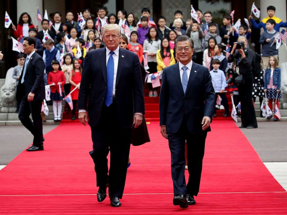 PHOTO: President Donald Trump and South Korean President Moon Jae-In walk towards a guard of honor during a welcoming ceremony at the presidential Blue House, Nov. 7, 2017, in Seoul, South Korea.