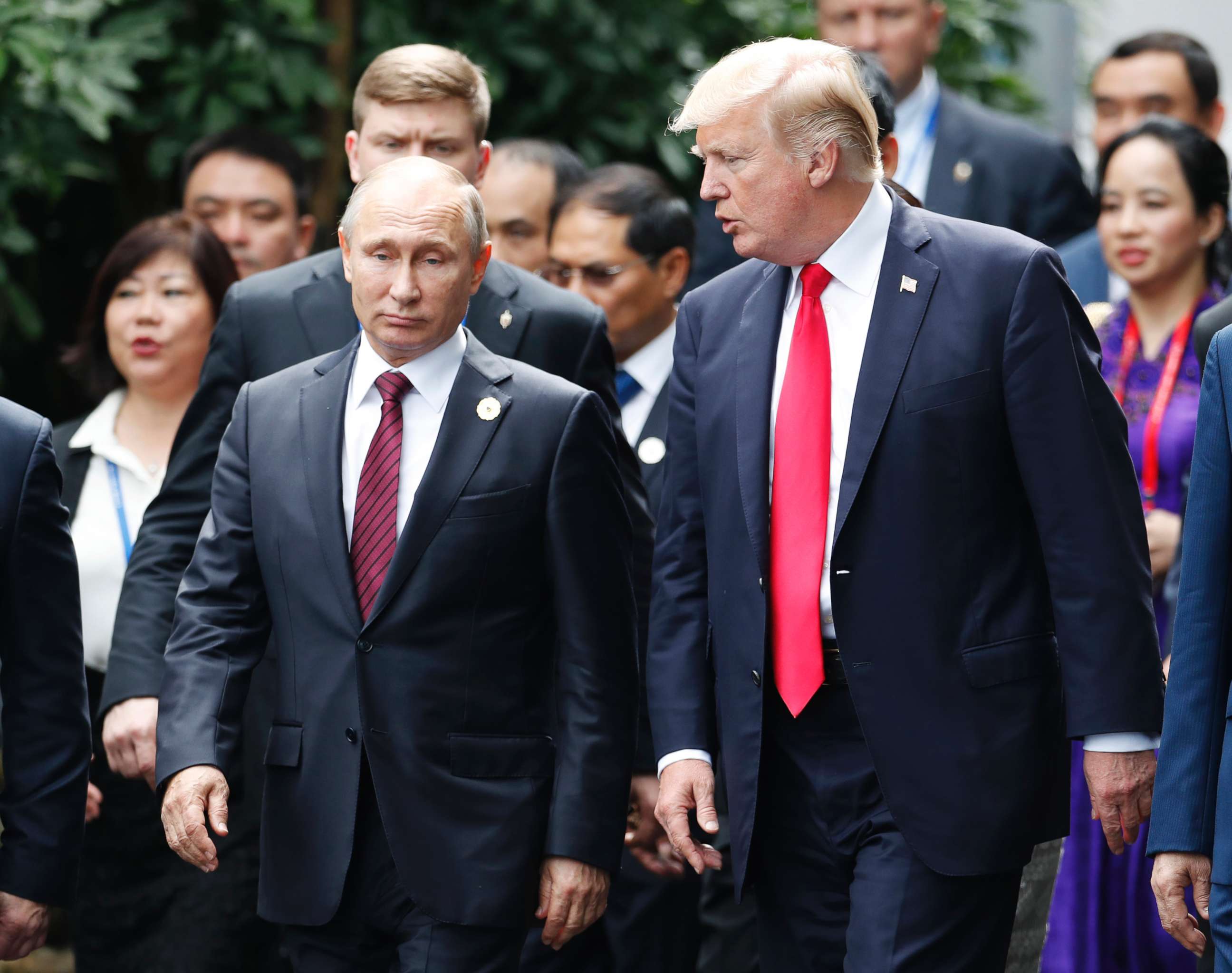 PHOTO: President Donald Trump, right, and Russia's President Vladimir Putin talk during the family photo session at the APEC Summit in Danang, Vietnam, Nov. 11, 2017.  