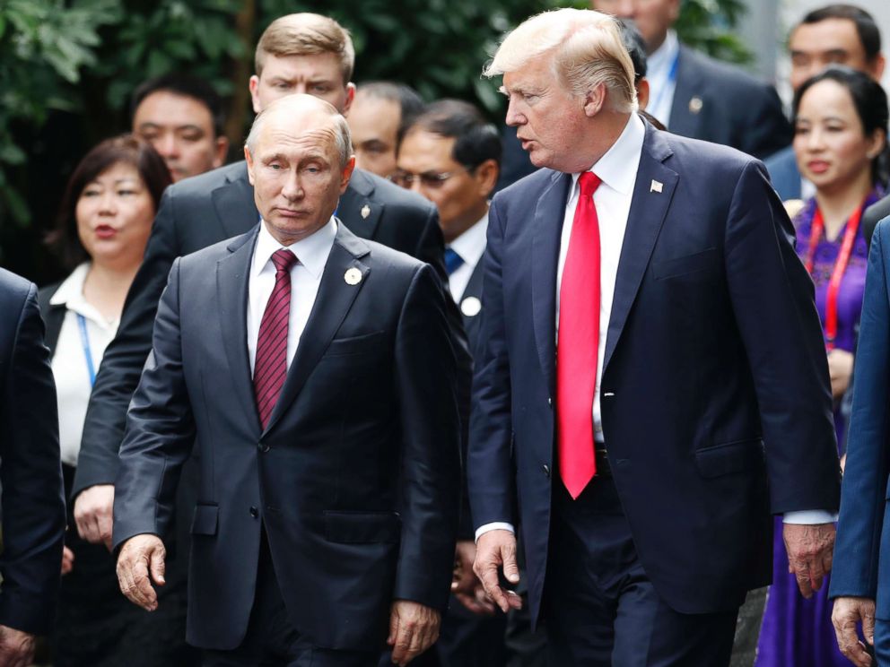 PHOTO: President Donald Trump, right, and Russias President Vladimir Putin talk during the family photo session at the APEC Summit in Danang, Vietnam, Nov. 11, 2017.