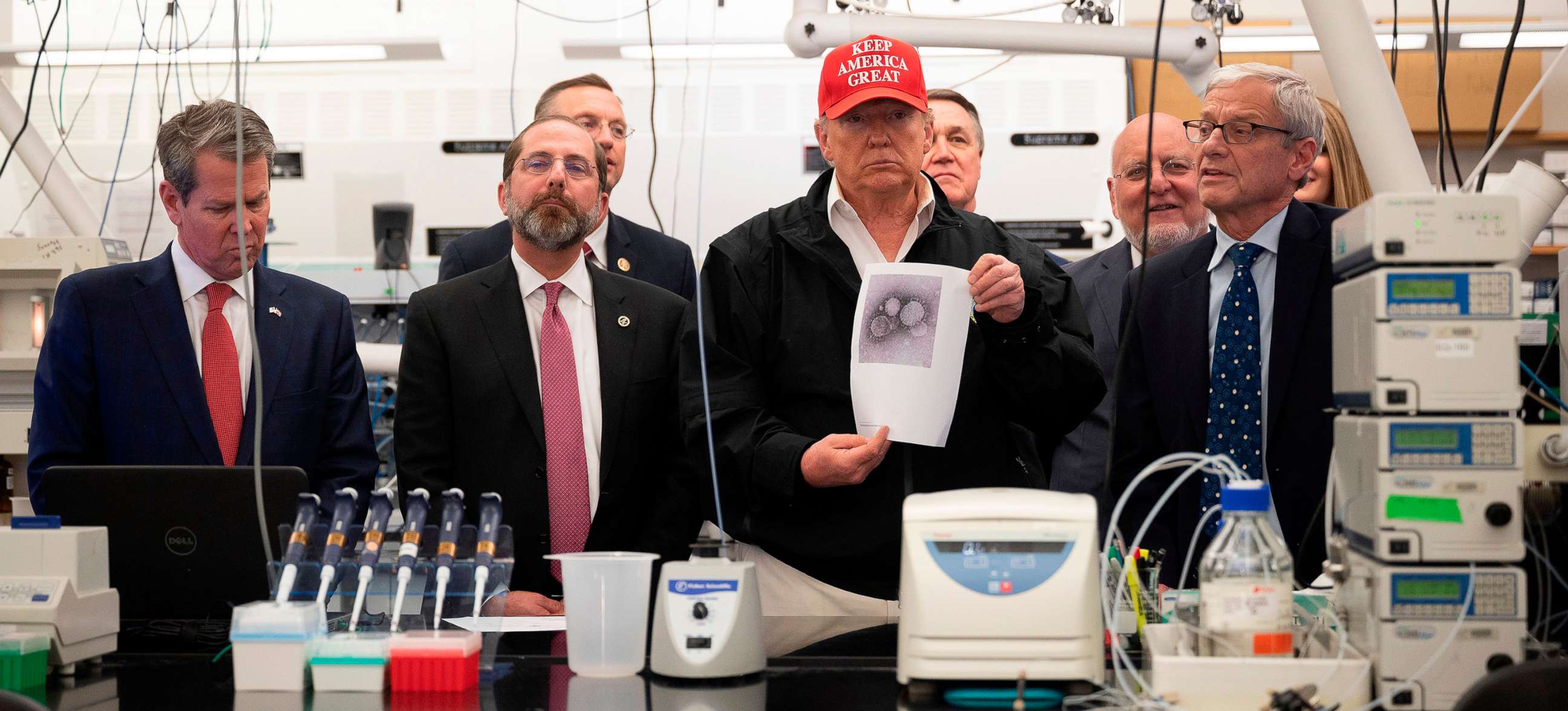 PHOTO: President Donald Trump holds a picture of the coronavirus during a tour of the Centers for Disease Control and Prevention (CDC) in Atlanta, Georgia, on March 6, 2020. 