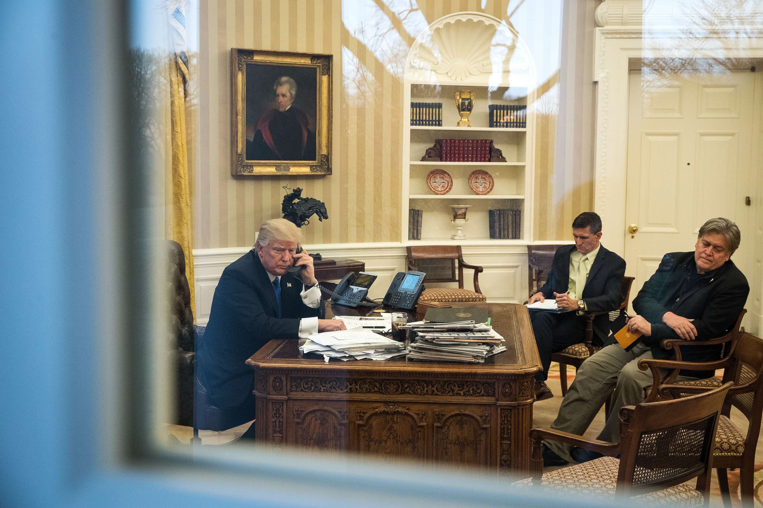 PHOTO: President Donald Trump speaks on the phone with Australian Prime Minister Malcolm Turnbull in the Oval Office of the White House, Jan. 28, 2017. National Security Advisor Michael Flynn and White House Chief Strategist Steve Bannon were present. 