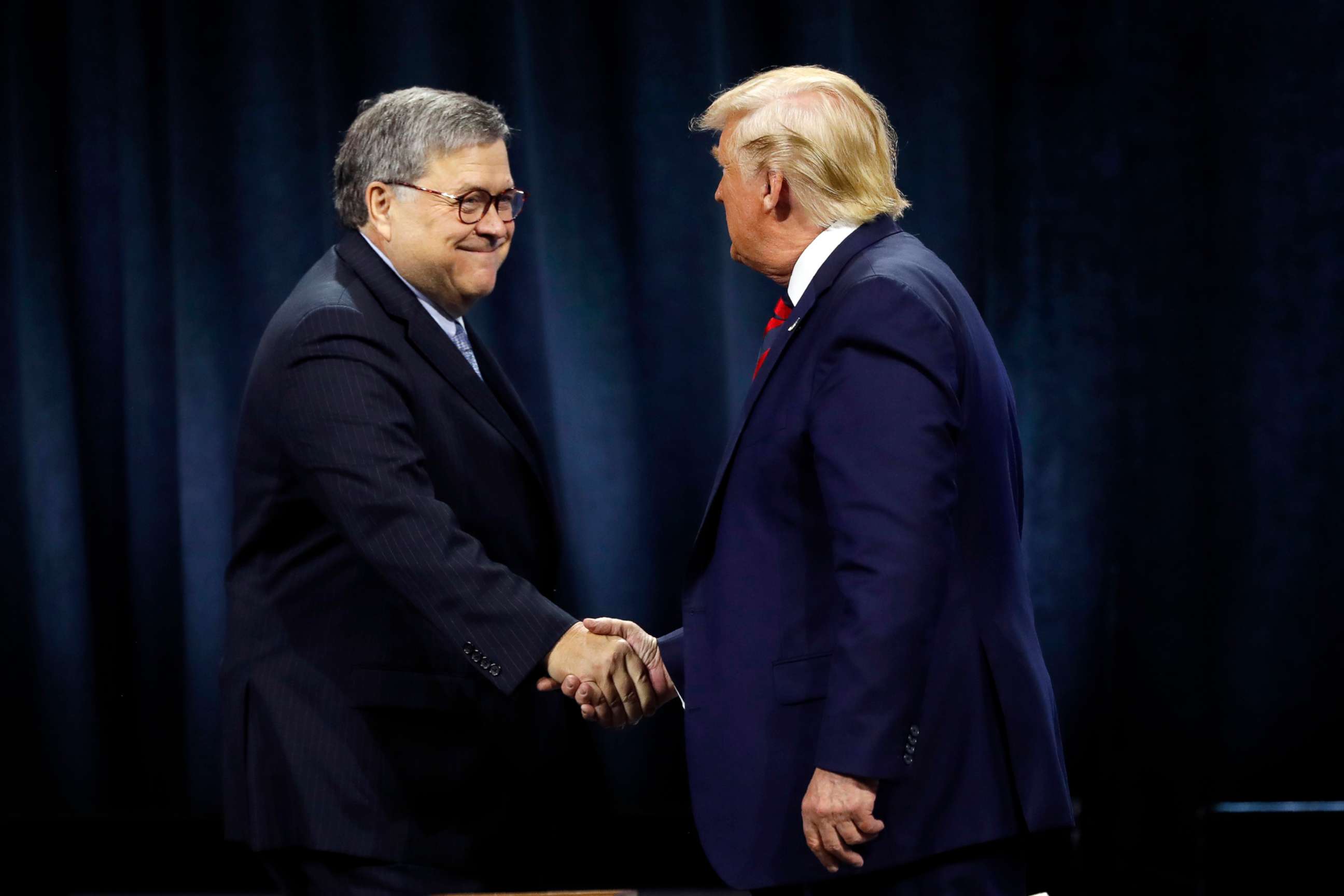 PHOTO: President Donald Trump shakes hands with Attorney General William Barr before an executive order signing in Chicago, Oct. 28, 2019.le)