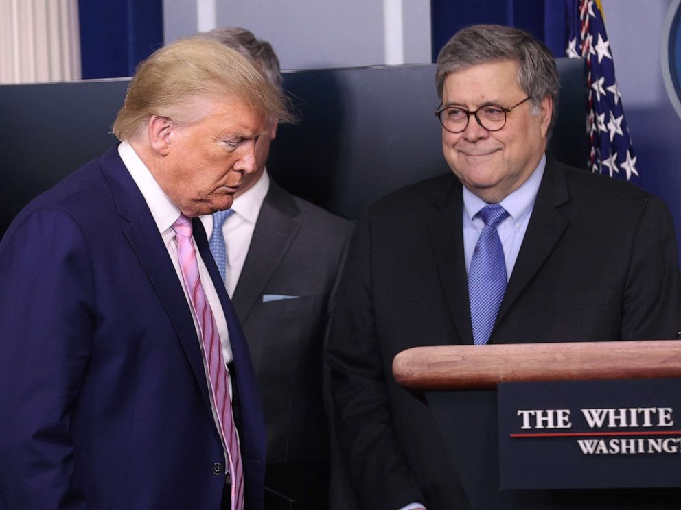 PHOTO: President Donald Trump arrives at the press briefing room flanked Attorney General William Barr and other administration officials, April 1, 2020, in Washington, D.C.