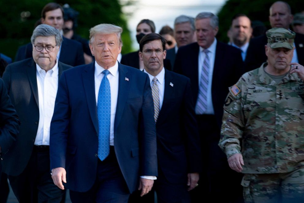 PHOTO: President Donald Trump walks with Attorney General William Barr, left, Secretary of Defense Mark T. Esper, center, Chairman of the Joint Chiefs of Staff Mark A. Milley, right, to St. John's Church after demonstrators were cleared, June 1, 2020.