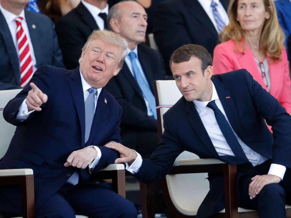 PHOTO: President Donald Trump and French President Emmanuel Macron attend the traditional Bastille day military parade on the Champs-Elysees on July 14, 2017 in Paris.