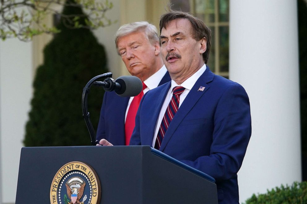 PHOTO: President Donald Trump listens as Mike Lindell, CEO of MyPillow Inc., speaks during the daily COVID-19 briefing at the White House, March 30, 2020.