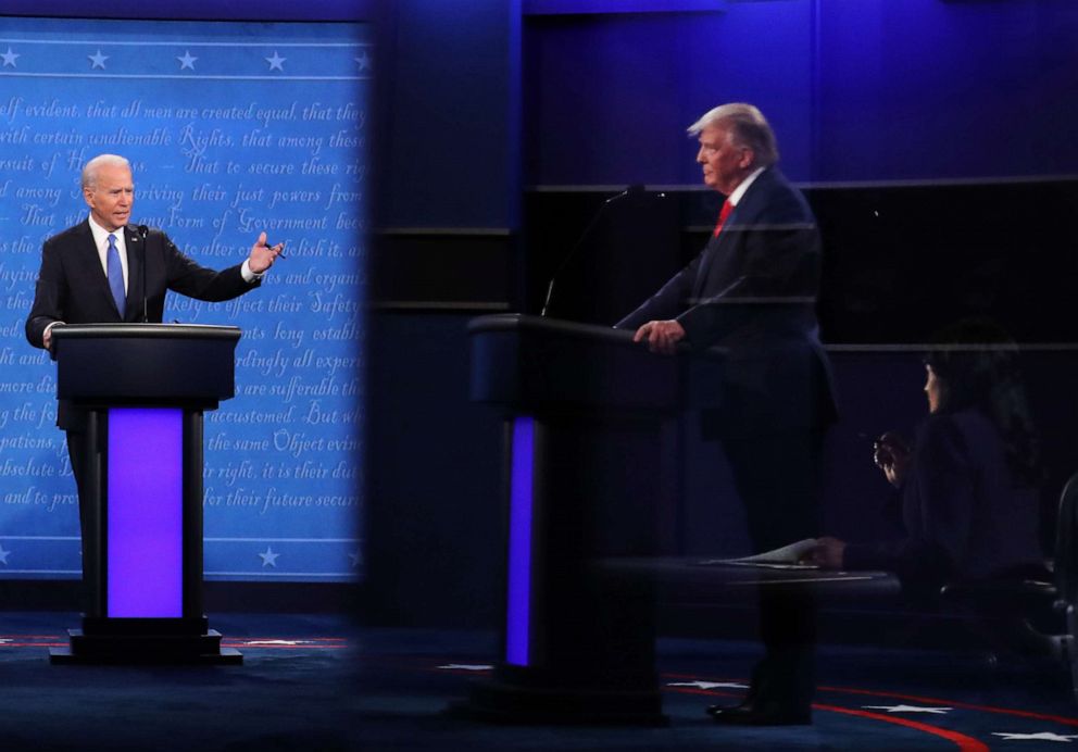 PHOTO: Democratic presidential nominee Joe Biden speaks while President Donald Trump, shown in reflection, listens during the final presidential debate at Belmont University on Oct. 22, 2020, in Nashville, Tenn.