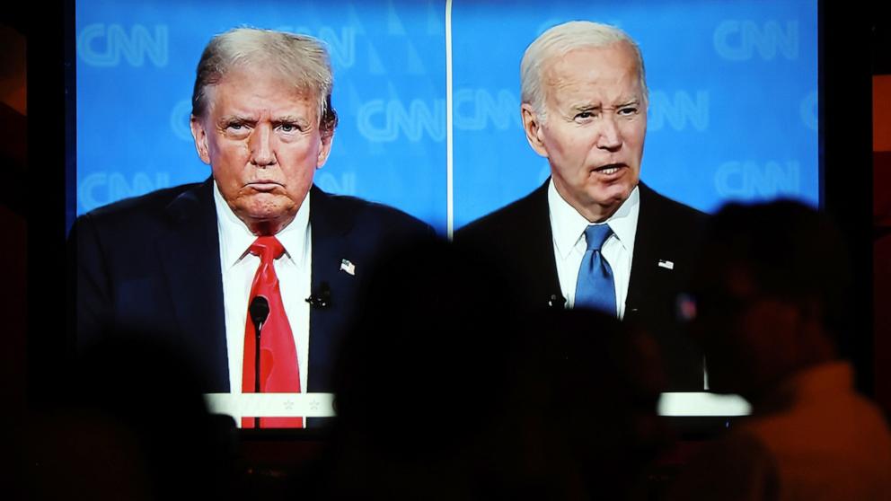 PHOTO: People watch the CNN presidential debate between Republican presidential candidate former President Donald Trump  and President Joe Biden at a watch party at The Continental Club on June 27, 2024 in Los Angeles.