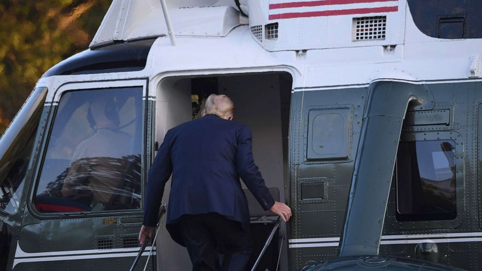 PHOTO: President Donald Trump boards Marine One prior to departure from the South Lawn of the White House, Oct. 2, 2020, as he heads to Walter Reed Military Medical Center, after testing positive for Covid-19.