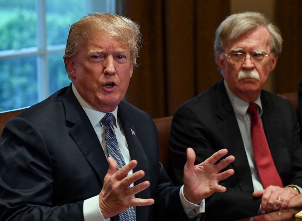 PHOTO: In this April 9, 2018, file photo, President Donald Trump flanked by national security advisor John Bolton, speaks to the media as he meets with senior military leadership in the Cabinet Room of the White House in Washington, D.C.