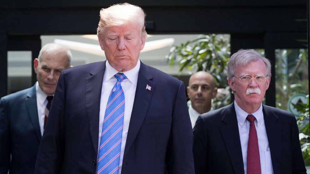 PHOTO: In this June 9, 2018, file photo, President Donald Trump, with National Security Advisor John Bolton (R) and White House Chief of Staff John Kelly (L), leaves the G7 summit in La Malbaie, Quebec.