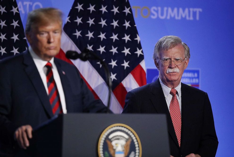 PHOTO: In this July 12, 2018, file photo, President Donald Trump, flanked by National Security Advisor John Bolton, speaks to the media at a press conference on the second day of the 2018 NATO Summit in Brussels, Belgium.