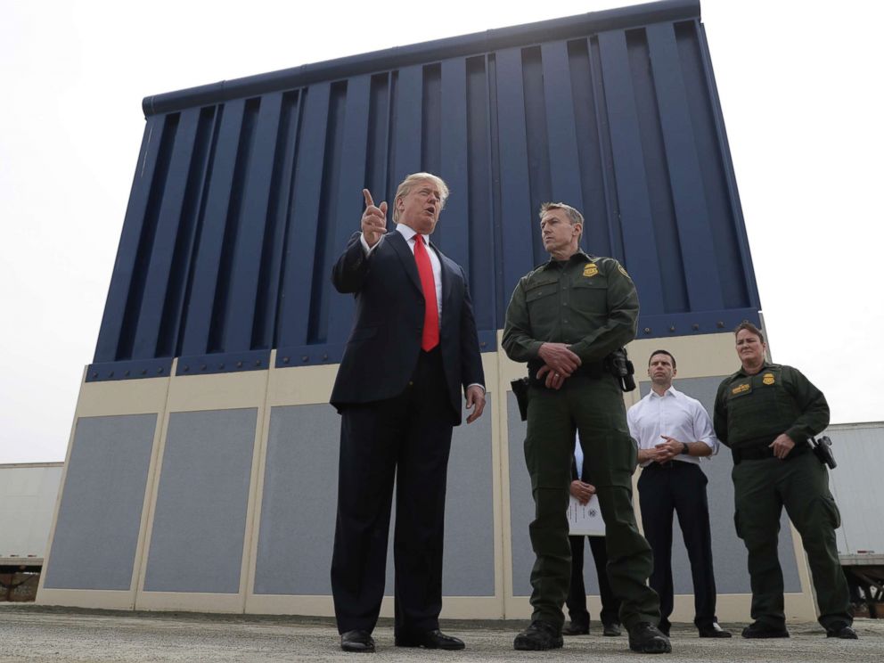 PHOTO: President Donald Trump speaks during a tour to review border wall prototypes, March 13, 2018, in San Diego, as Rodney Scott, the Border Patrols San Diego sector chief, listens. 