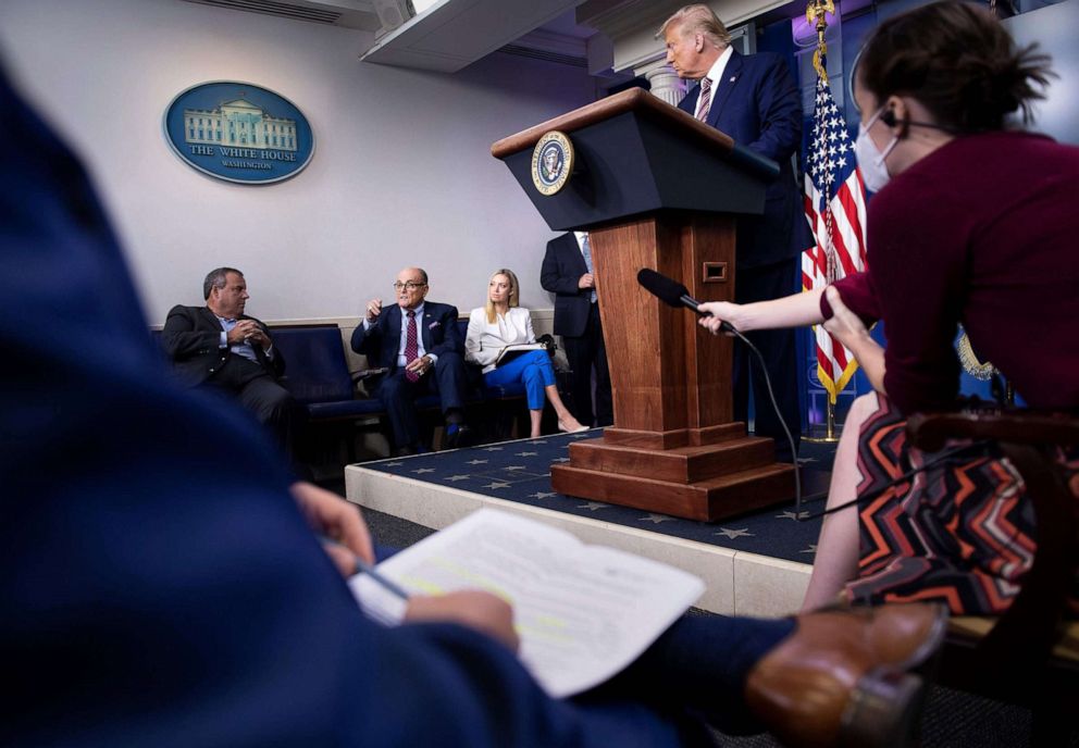 PHOTO: Former New Jersey Governor Chris Christie, former New York City Mayor Rudy Giuliani and White House Press Secretary Kayleigh McEnany, attend a briefing with President Donald Trump, and members of the press at the White House, Sept. 27, 2020.