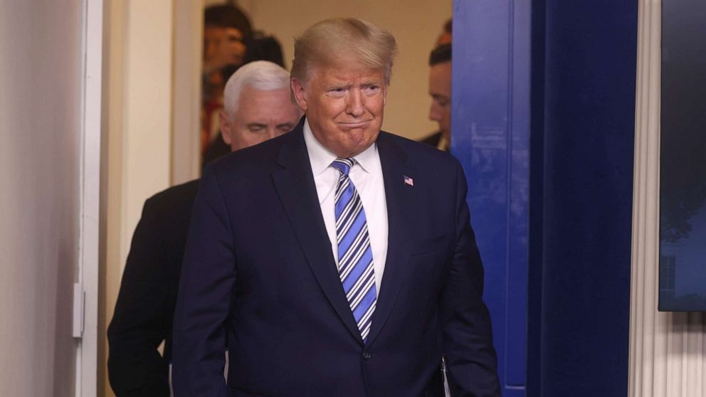 PHOTO: President Donald Trump is followed by Vice President Mike Pence as he arrives for the coronavirus response daily briefing at the White House, March 23, 2020.