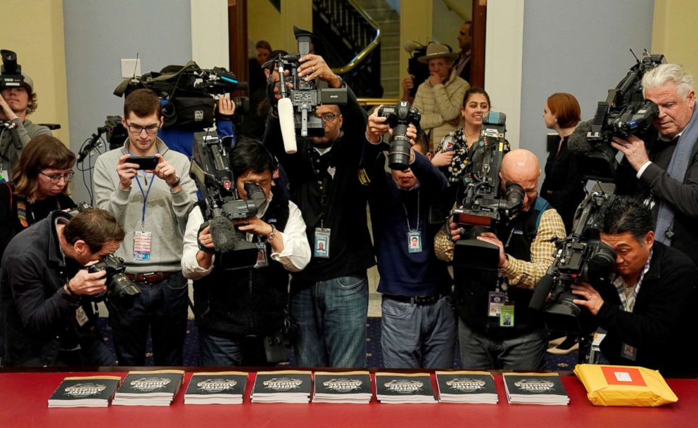 PHOTO: Members of the media point their cameras at copies of Volume 1 of U.S. President Donald Trump's budget for Fiscal Year 2020 in Washington.