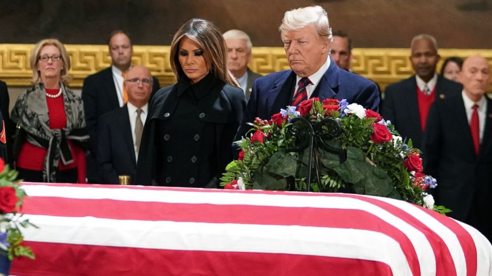 PHOTO: President Donald Trump and first lady Melania Trump pay their respects as former president George H. W. Bush lies in state in the Rotunda of the US Capitol in Washington, Dec. 3, 2018.