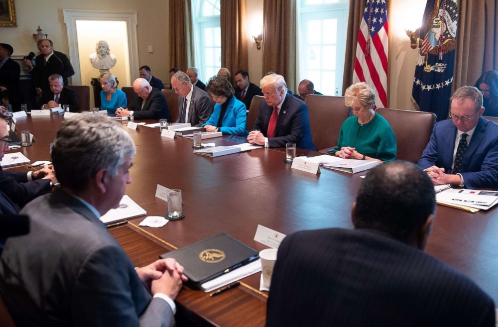 PHOTO: President Donald Trump prays with members of his cabinet during a cabinet meeting in the Cabinet Room of the White House in Washington, on Oct. 17, 2018.