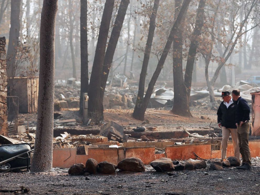 PHOTO: President Donald Trump visits the charred wreckage of Skyway Villa Mobile Home and RV Park with FEMA head Brock Long, right, in Paradise, Calif., Nov. 17, 2018.