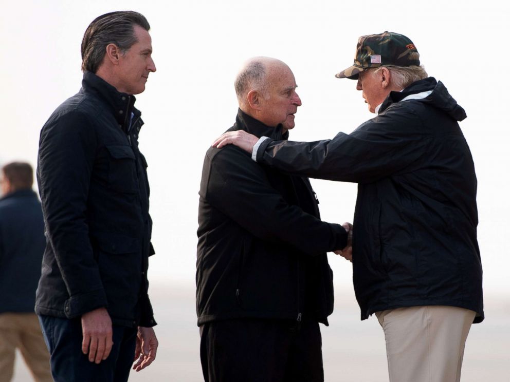 PHOTO: President Donald Trump greets California Governor Jerry Brown and Governor-elect Gavin Newsom on the left as he arrives at Beale Air Force Base in California on November 17, 2018.