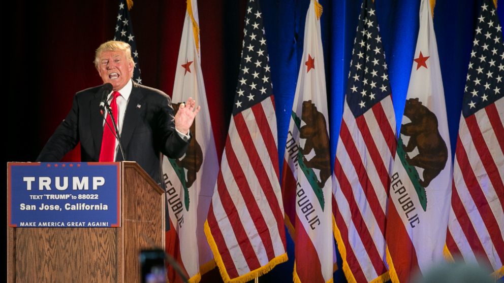 Donald Trump speaks in front of a row of California state and American flags at a campaign rally on June 2, 2016 in San Jose. 