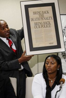 PHOTO: On Dec. 19, 2002, Angela Cuffie meets reporters at Manhattan Supreme Court and Councilman Bill Perkin s holds up an advertisement taken out by Donald Trump after the crime.