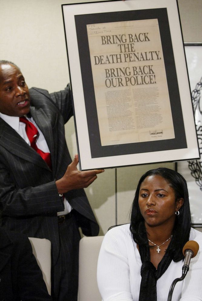 PHOTO: On Dec. 19, 2002, Angela Cuffie meets reporters at Manhattan Supreme Court and Councilman Bill Perkin s holds up an advertisement taken out by Donald Trump after the crime.  
