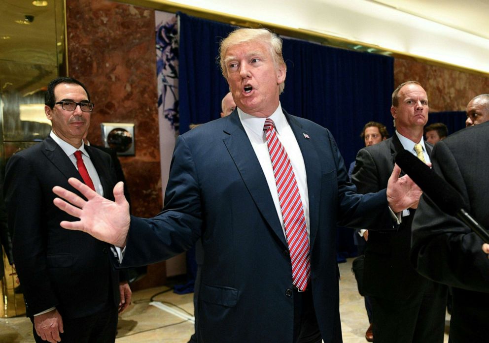 PHOTO: President Donald Trump answers questions about protests in Charlottesville  after his statement on the infrastructure discussion in the lobby at Trump Tower in New York on Aug. 15, 2017.